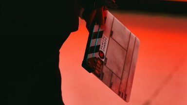 A blank clapperboard with the Film and TV Charity logo on it.