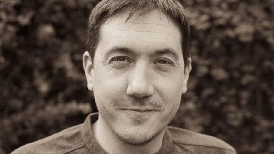 Headshot of previous John Brabourne Award Winner, David Proud