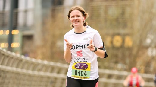 Someone running a race to raise money for the Film and TV Charity.
