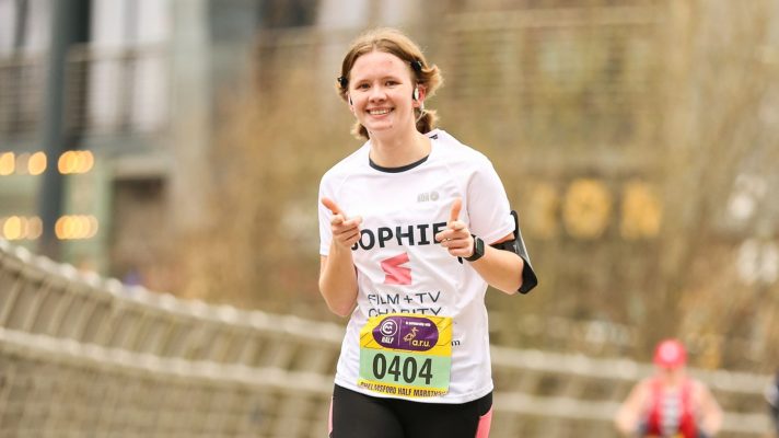 Someone running a race to raise money for the Film and TV Charity.