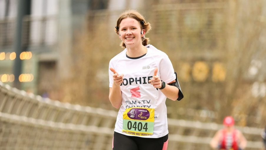 Someone running a race to raise money for the Film and TV Charity.